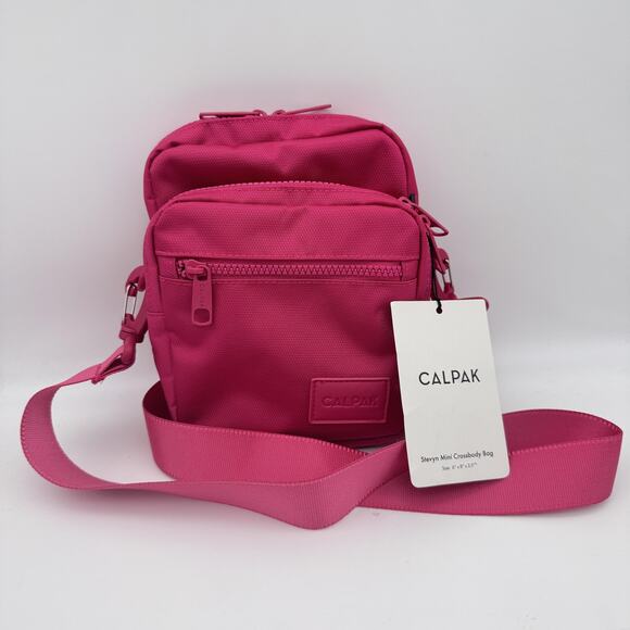 Calpak Stevyn Mini Crossbody Bag Dragon Fruit Pink Adjustable Womens Travel NEW - Picture 1 of 8